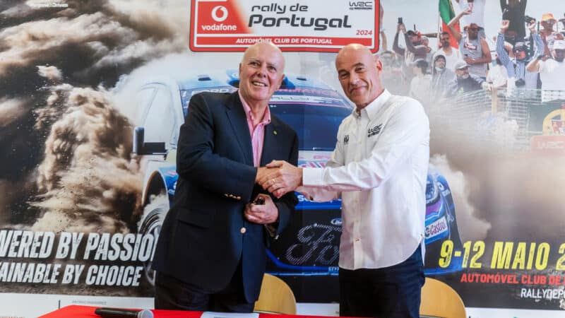 Jona Siebel (right) and Carlos Barbosa shake hands after renewing Portugal's contract in the FIA World Rally